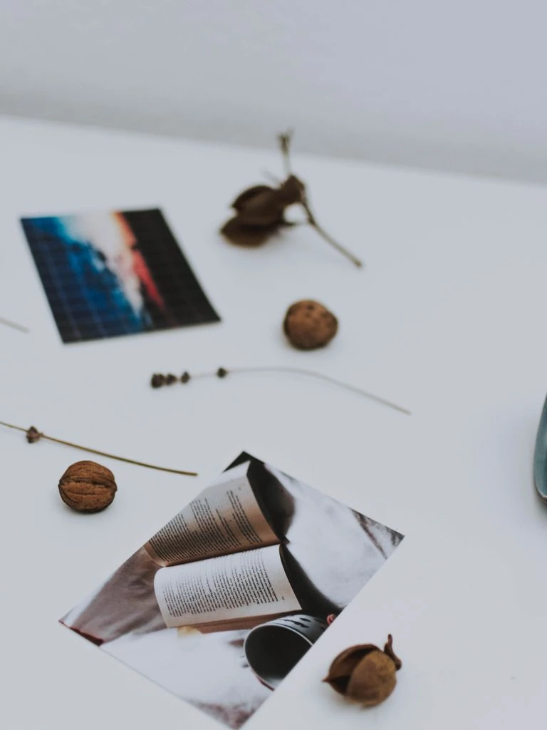 A printed Brand Elasticity Score report lying open on a linen-covered studio desk.